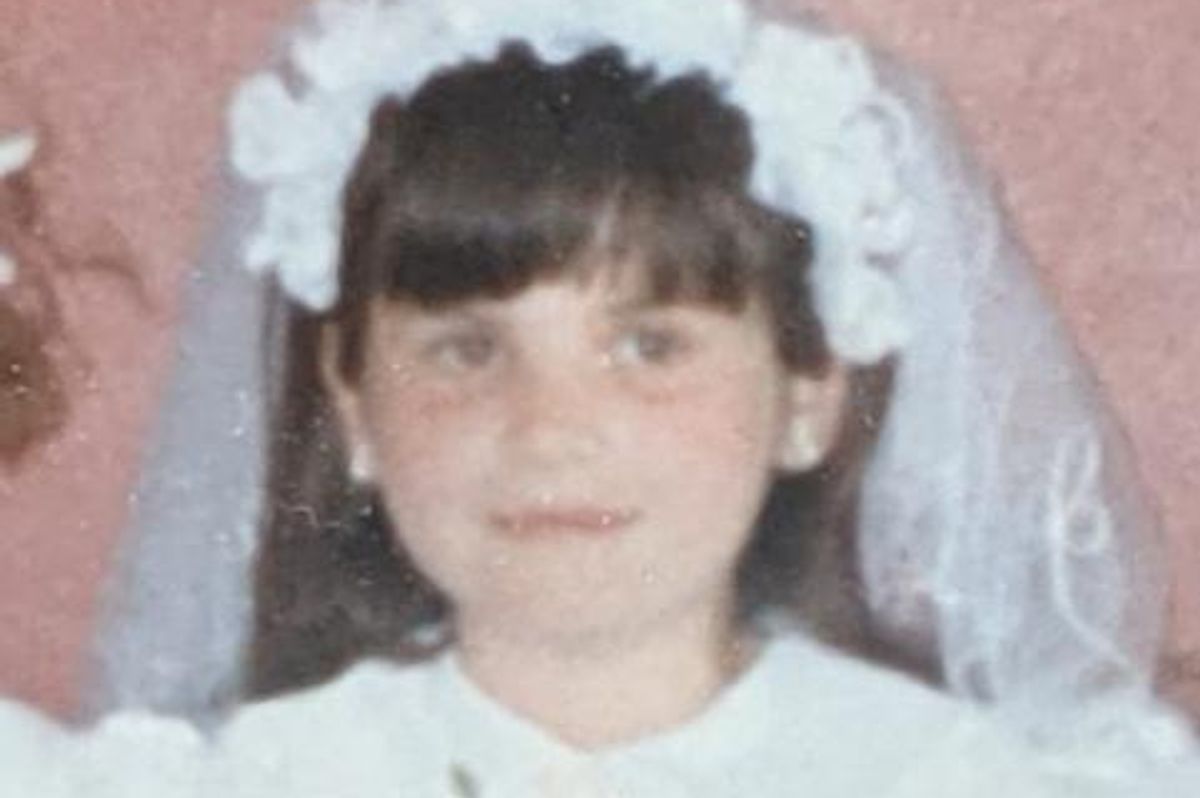 The author pictured in her first Holy Communion dress - she's a Catholic but not devout