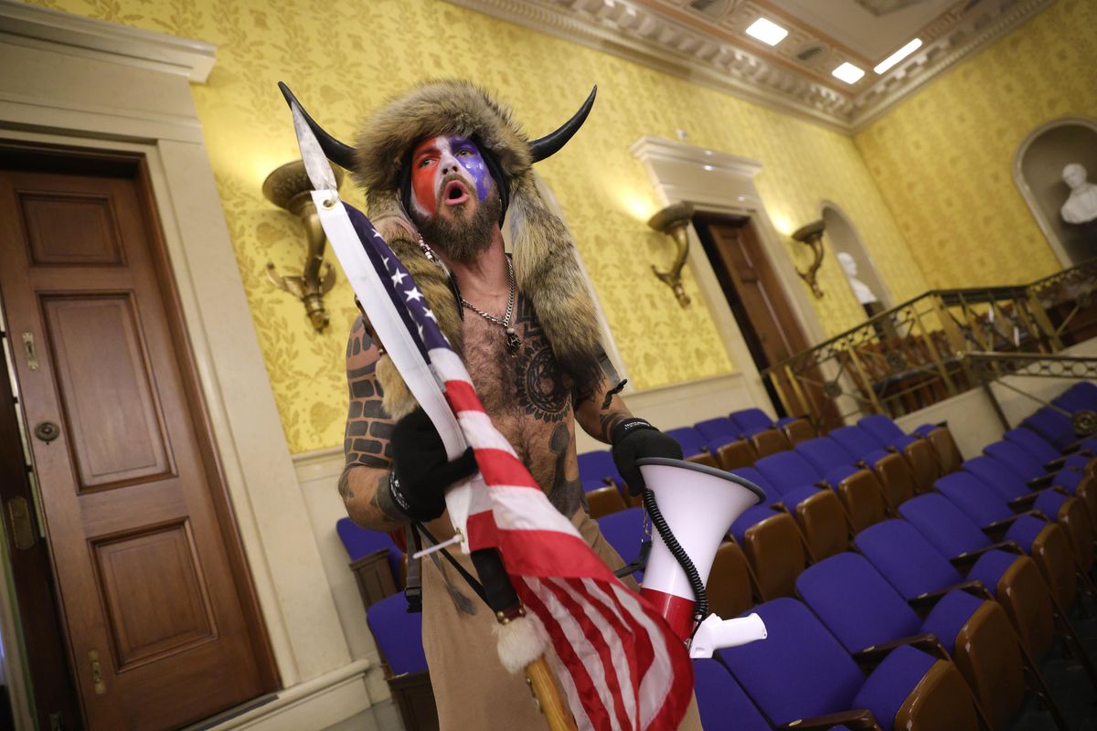 Is the ‘QAnon Shaman’ really reconsidering his Trump support due to the Lil Wayne pardon?